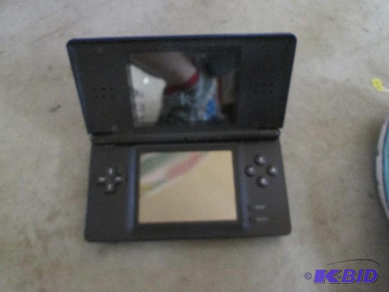 lot 121 image: nintendo DS lite in navy blue no chargerused...