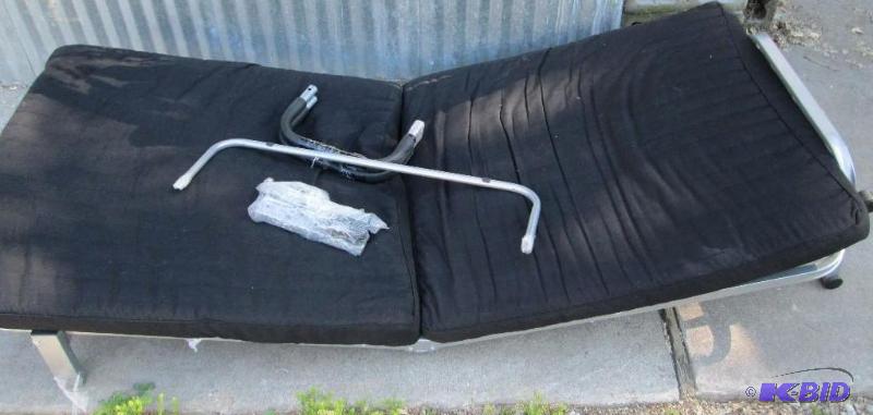 lot 209 image: New Folding bed on wheels, plush fabric top. ...
