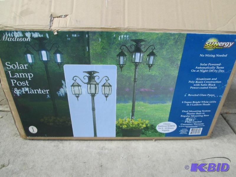 lot 54 image: Solar lamp post and planter, open box, appear...