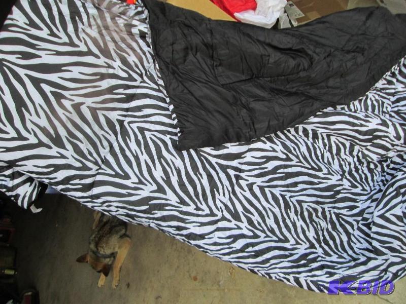 lot 56 image: Zebra comforter, has some discoloration, cust...