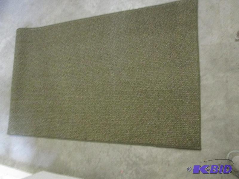 lot 71 image: dark green rug 8 and a halfin x 114in...