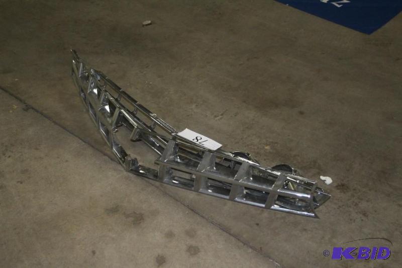 Lot of grilles and headlights for unknown veh...