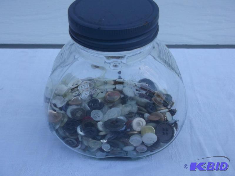 lot 73 image: Large jar half full of Buttons....