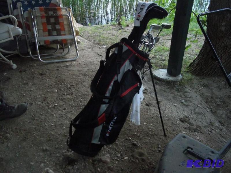 lot 108 image: Golf clubs and bag