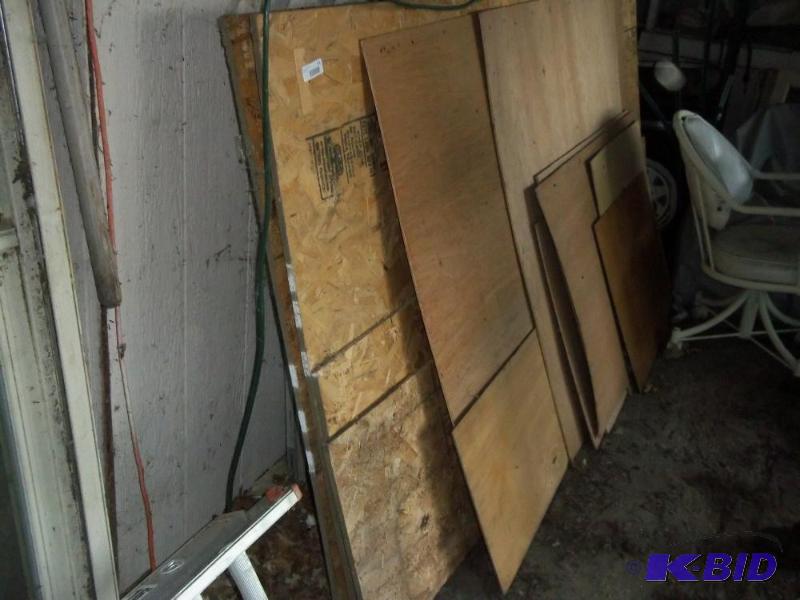 lot 111 image: Pile of Misc lumber and windows