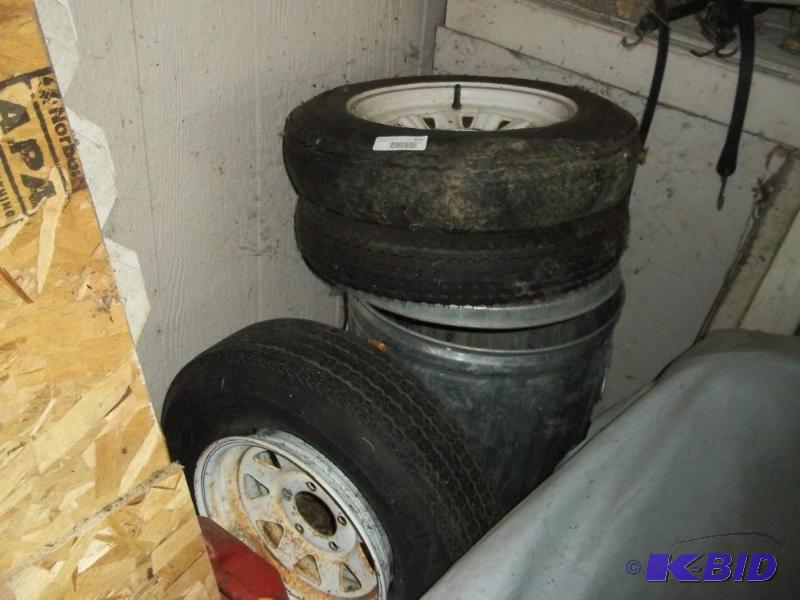 lot 116 image: 3 spare trailer tires, metal trachcan, plastic gas can