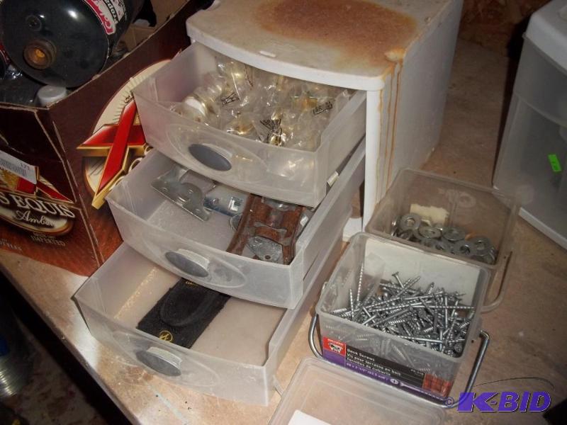 lot 174 image: 3 drawer storage container with door knobs, flag pole holders, screws, and washers