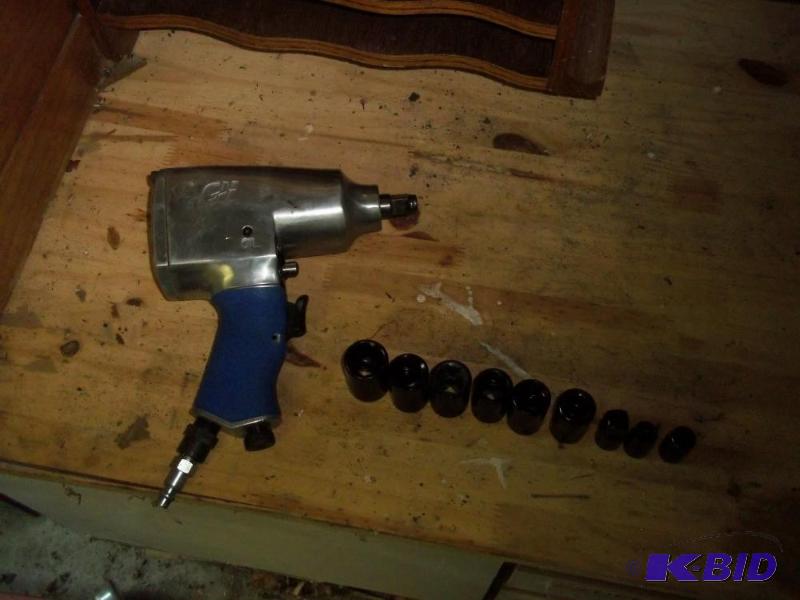 lot 231 image: 12 drive impact wrench with sockets barely used.