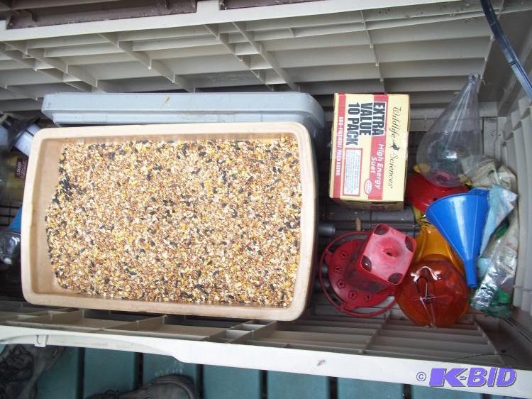 lot 28 image: 3 hummingbird feeders, thermos brand cooler full of bird seed, 10Pk suet,