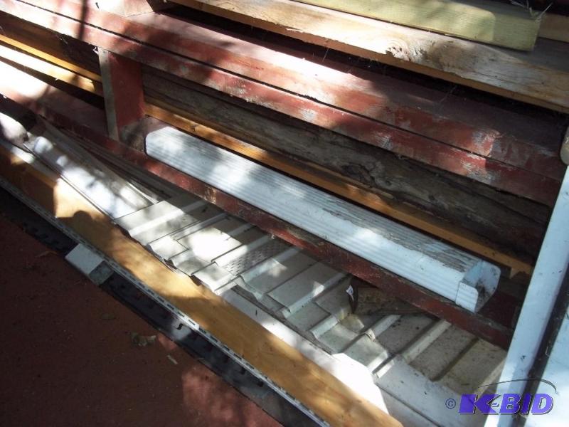 lot 295 image: misc shelves of wood including bi fold closet doors (everything in picture)