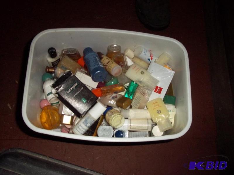 lot 298 image: trash can with lid full of travel toiletries