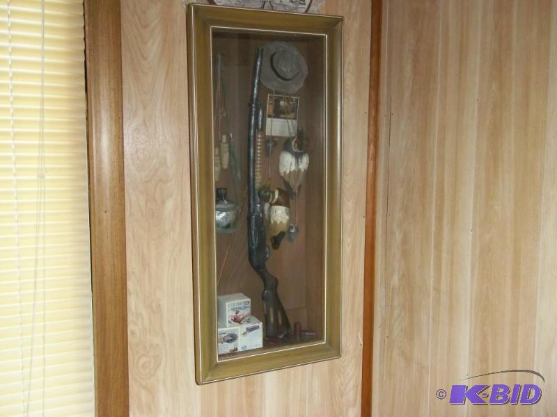 lot 319 image: Shadow box with shotgun and duck decoys