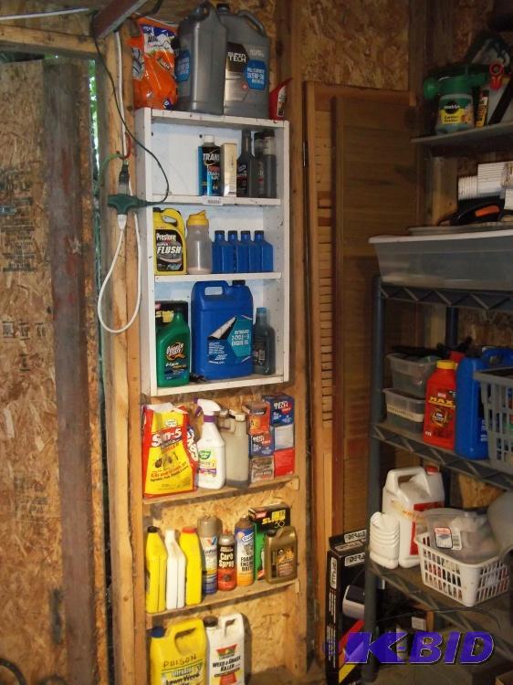 lot 82 image: Whole wall of oil, oil filters, insect killer,