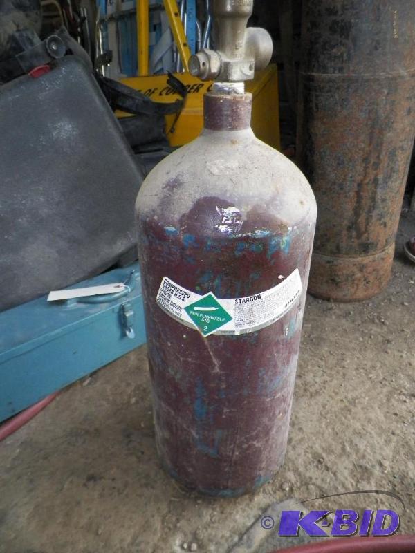 lot 17 image: Empty Praxair Stargon Tank Owned Not Rented Approx. 21 Tall wValve Approx. 7 12 Diameter