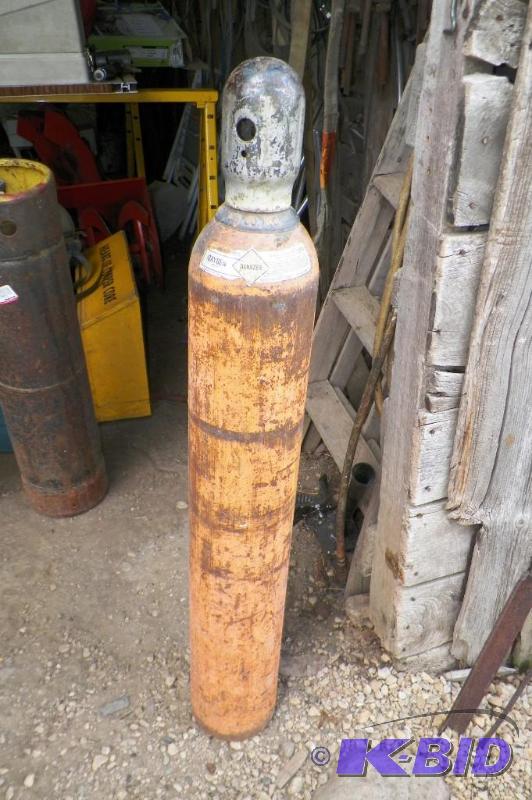 lot 18 image: Oxygen Tank Not Empty Owned Not Rented Approx. 48 Tall Approx. 7 Diameter