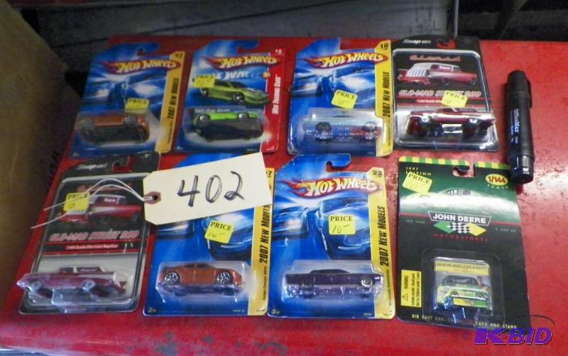 lot 402 image: Lot of 8 Cars Including Hot Wheels & Glo-Mad