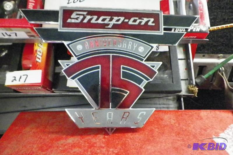 lot 598 image: Snap-on 75th Anniversary Cast Metal Emblem