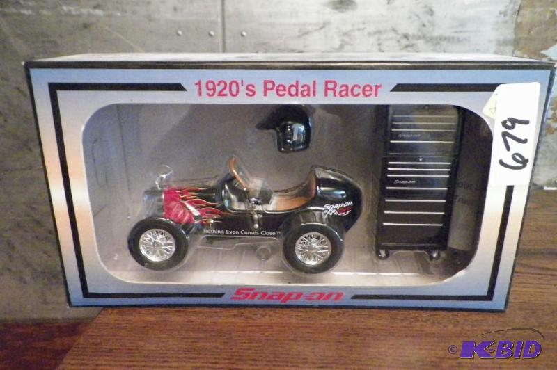 lot 679 image: Snap-on 1920s Pedal Racer Bank wTool Box