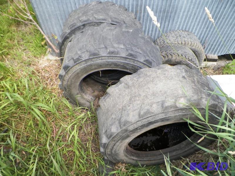 lot 949 image: Three Skid Steer Tires 10x16.5 For Recapping. Two 20x8x10 Tires Very Rough.