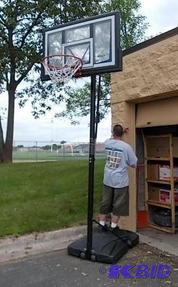 lot 26 image: Lifetime Shatterproof Basketball Hoop With Ea...