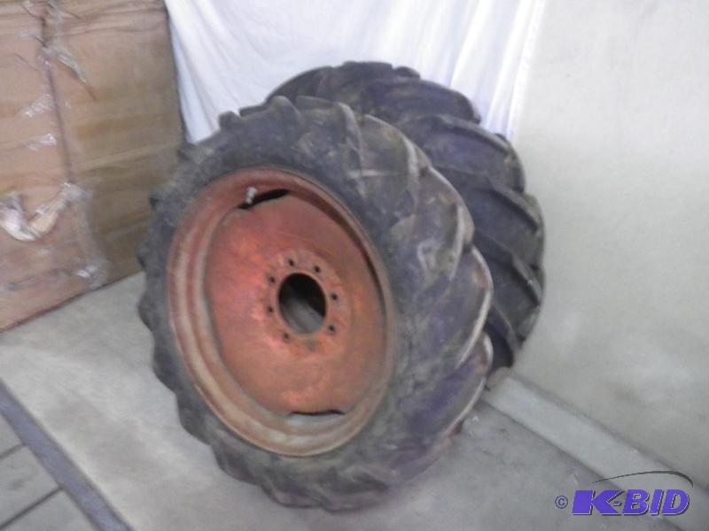 2 goodyear 8.3-24 tires on implement rims, ve...