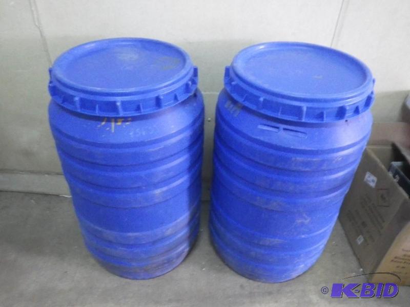 2 approx 35 gal plastic barrels with screw on...