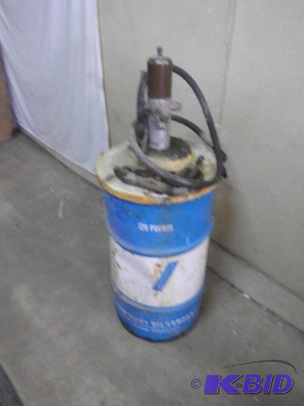 Grease pump and 12 container full of grease...
