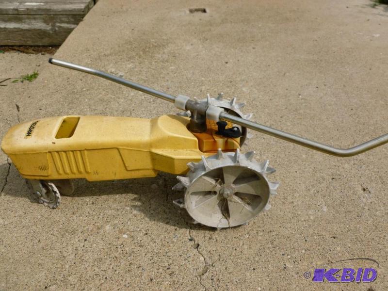 lot 8 image: Large Nelson cast metal tractor lawn sprinkle...