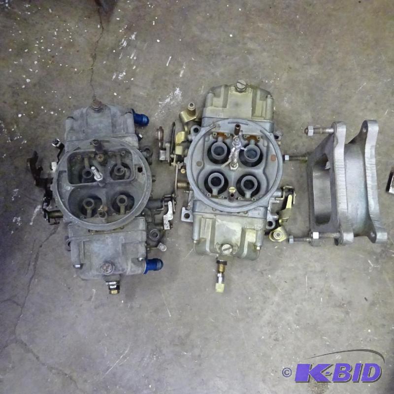 lot 219 image: 2- carburetors and 1 riser plate...