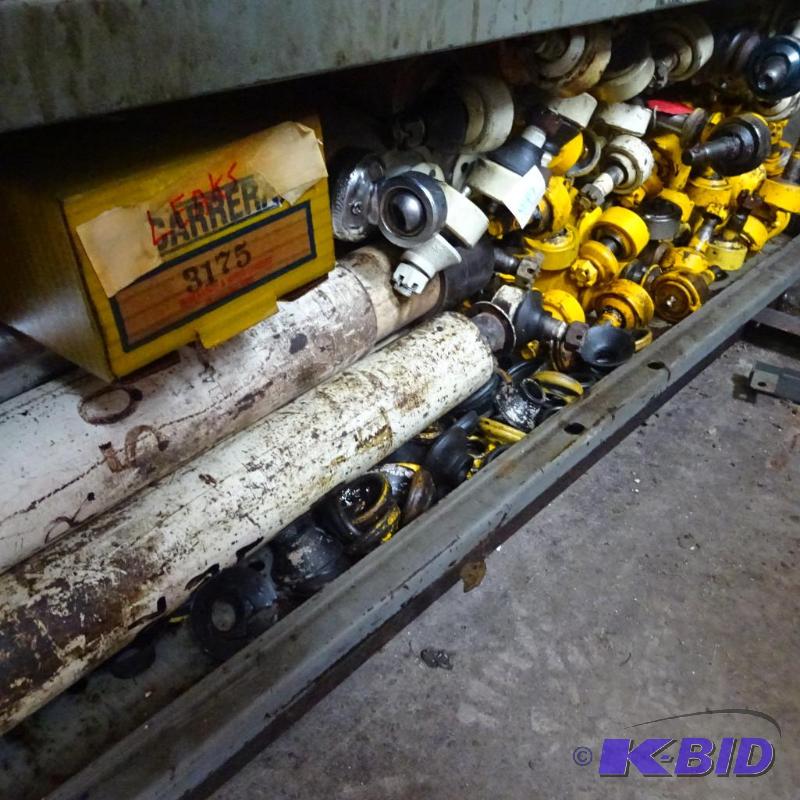 lot 447 image: Shelf of misc. used racing shocks and parts...