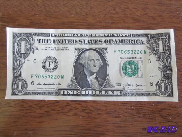 lot 1 image: Rare crisp 2009 $1 double president face reve...