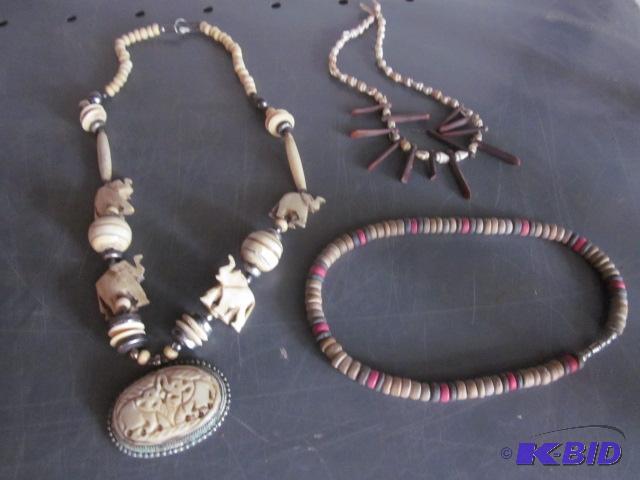 lot 103 image: Vintage carved bone and metal elephant neckla...