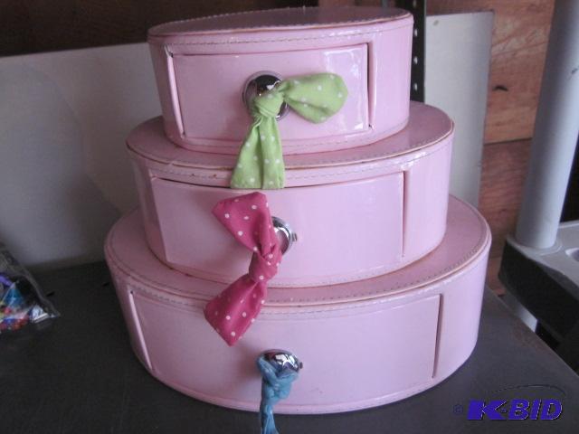 lot 106 image: (3) tiered pink jewelry box with ribbon pulls...