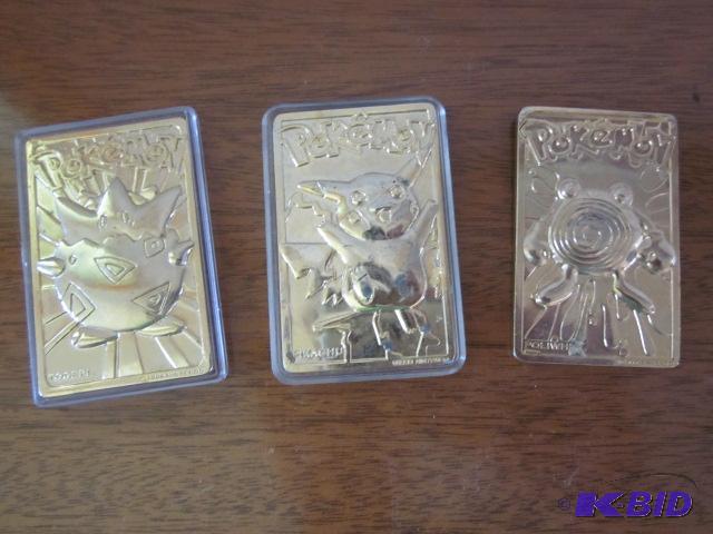 lot 45 image: (3) Poke Man gold cards. ...
