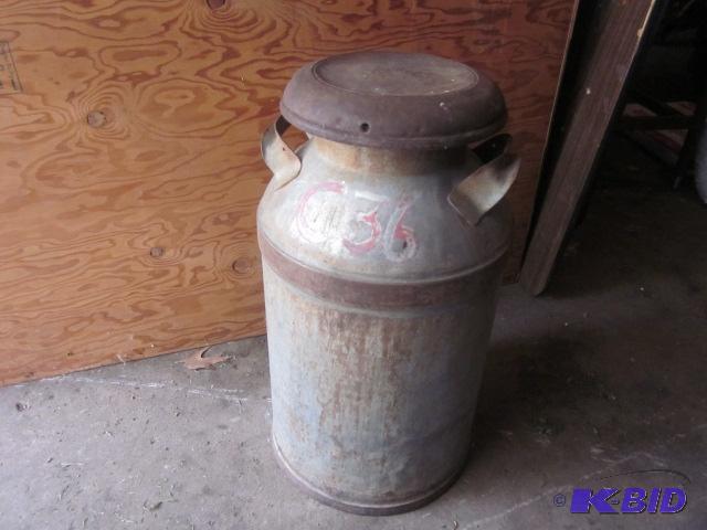 lot 63 image: 23 inches tall, Large vintage metal milk jug ...