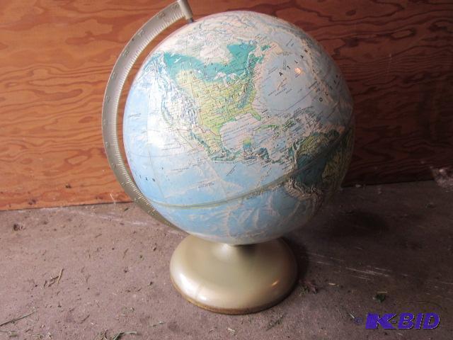 lot 66 image: Vintage metal base world globe with raised mo...