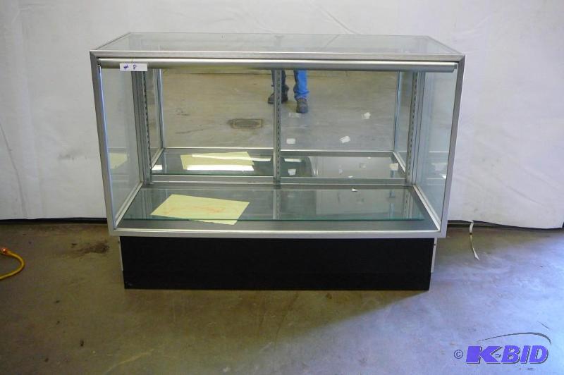Glass display case with lights and sliding do...