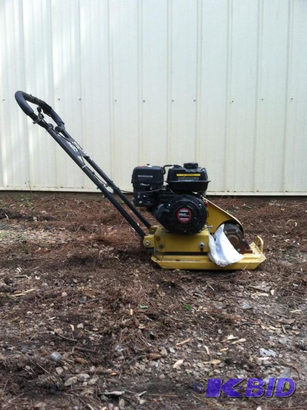 lot 54 image: Brand New Vibrating Plate Compactor- narrow design make it great for wall base applications. NEW