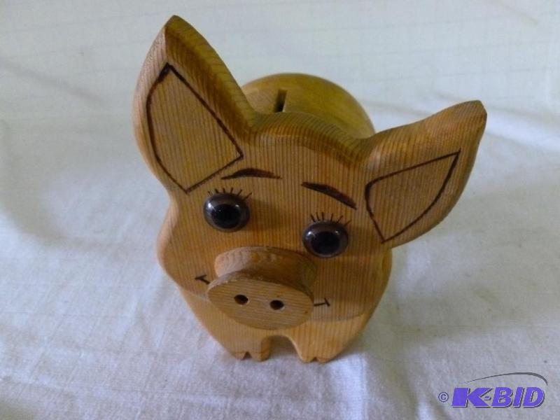 lot 102 image: Custom made wooden pig coin bank that measure...