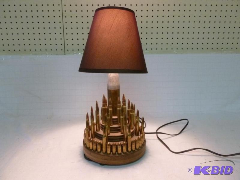 lot 13 image: Vintage custom made bullet lamp that measures...