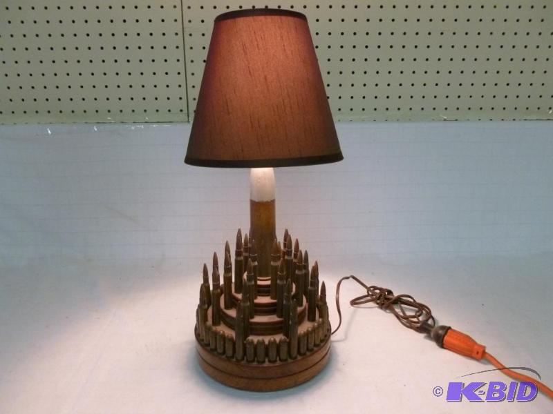 lot 14 image: Vintage custom made bullet lamp that measures...
