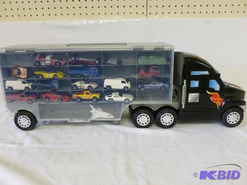 lot 140 image: Large heavy gage plastic die cast car display...