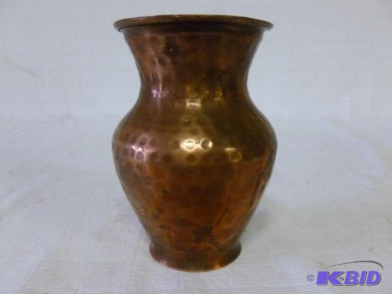 lot 33 image: Vintage hammered copper vase that measures 5....