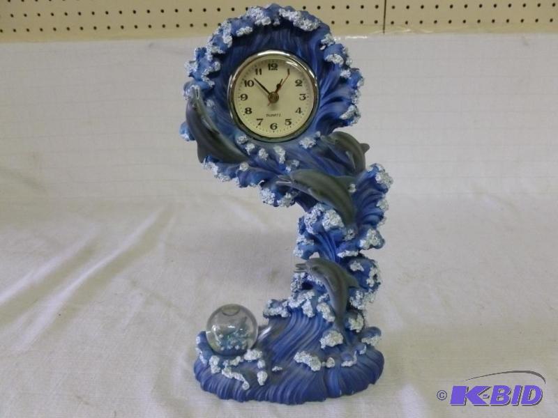 lot 44 image: Large molded resin dolphin dresser quartz clo...