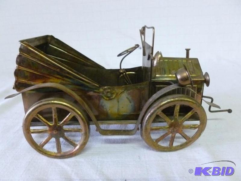 lot 45 image: Vintage cut metal old time car music box deco...