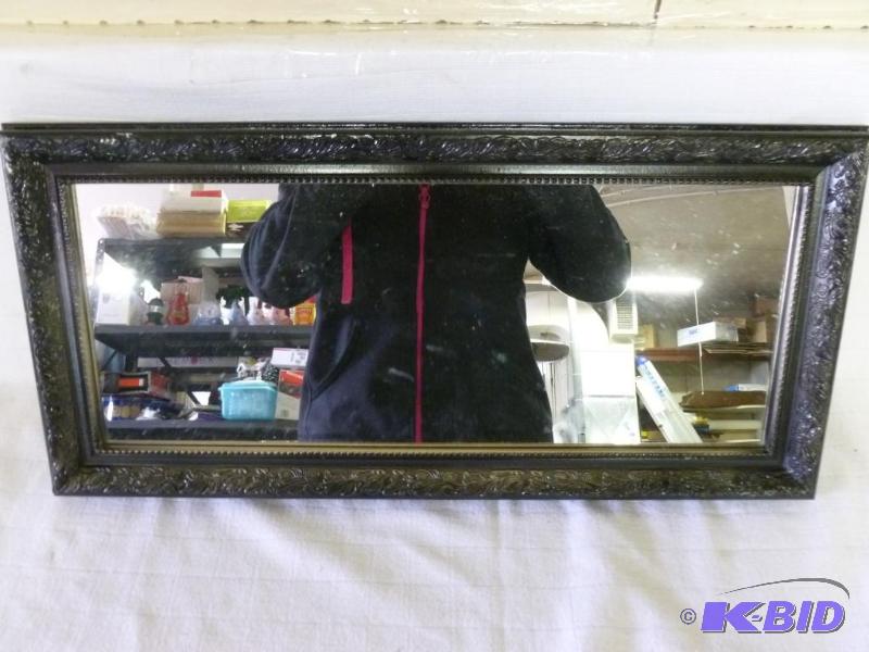lot 53 image: Decorative wood framed hall mirror that measu...