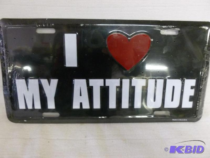 lot 85 image: I Love My Attitude embossed metal license pla...