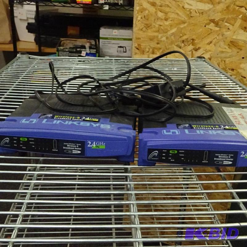 lot 134 image: Linksys router. Includes power cords...