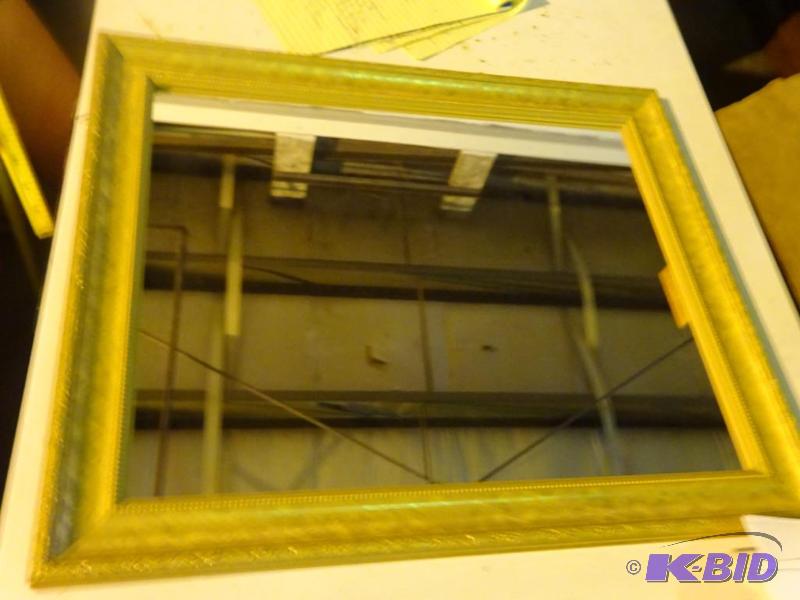 Gold trim mirror. 24 x 19 12...