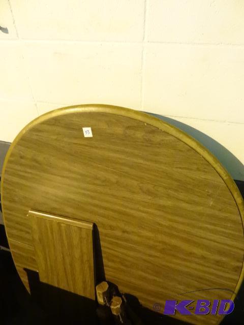 Wooden oval dining table. 4 legs not attached...